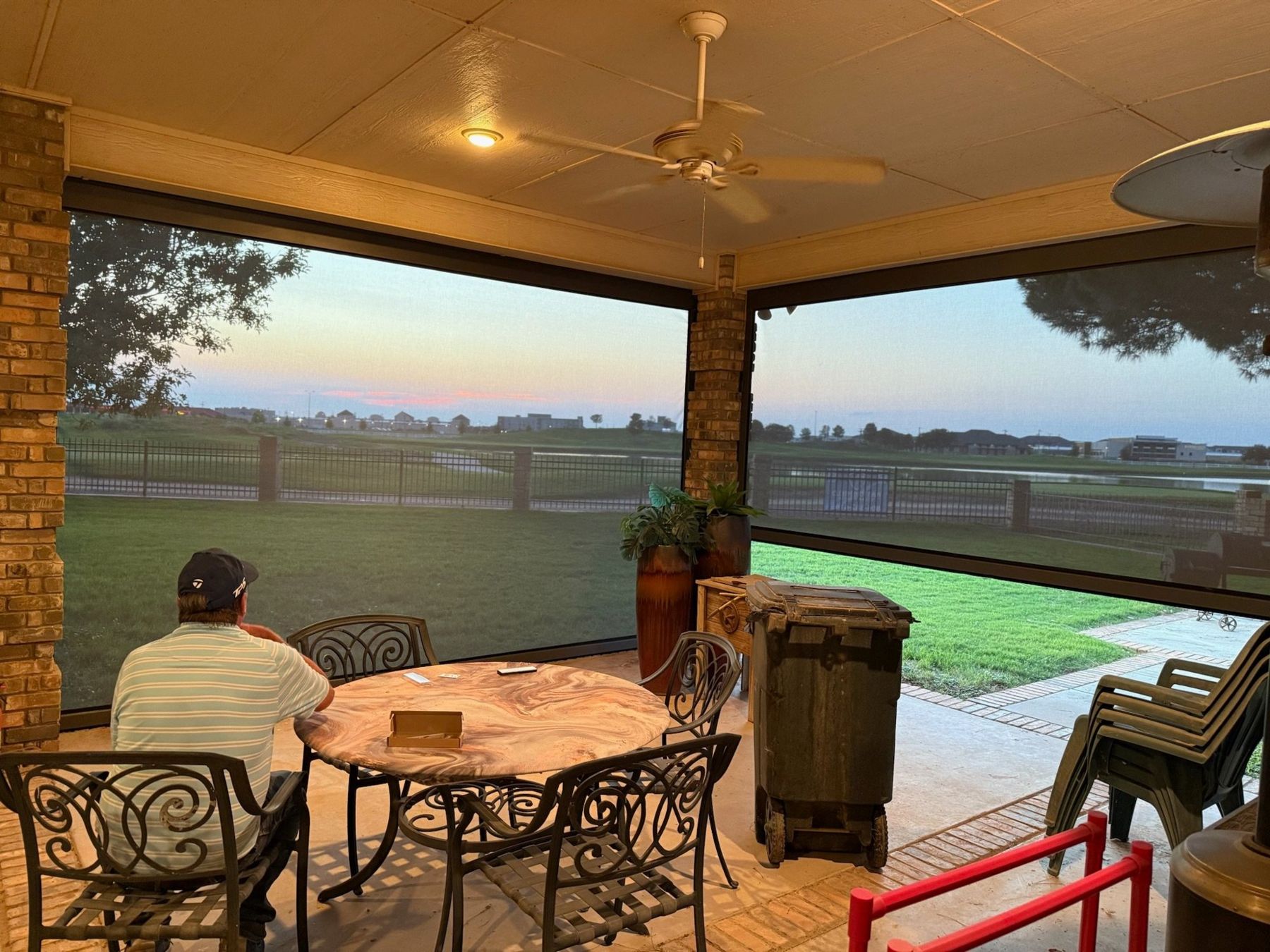 Evening on a screened patio overlooking the water