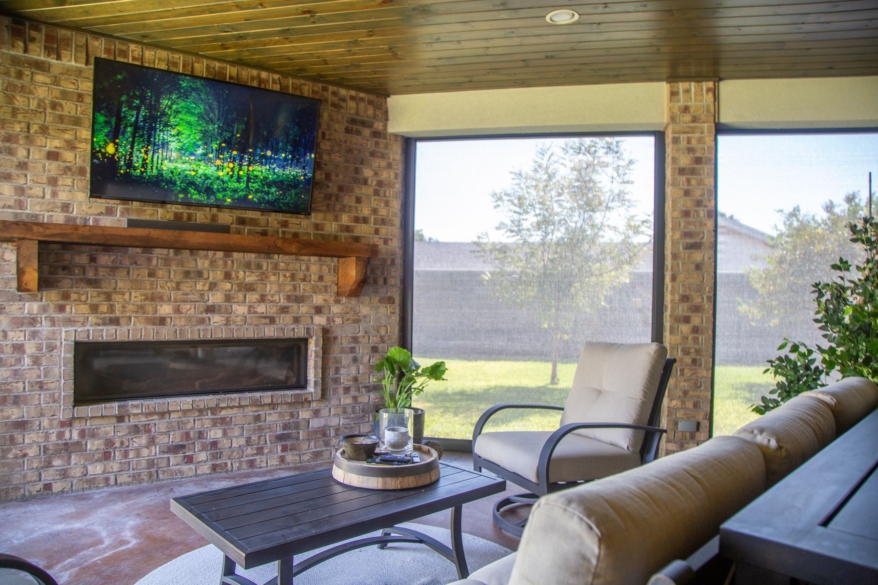 Screened patio living room with fireplace