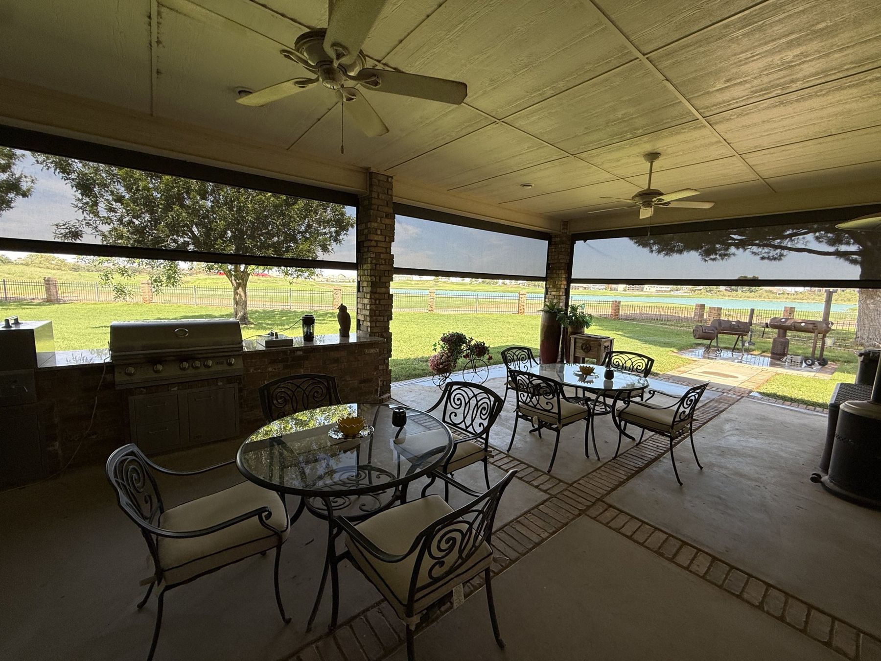 Outdoor kitchen with screens half lowered