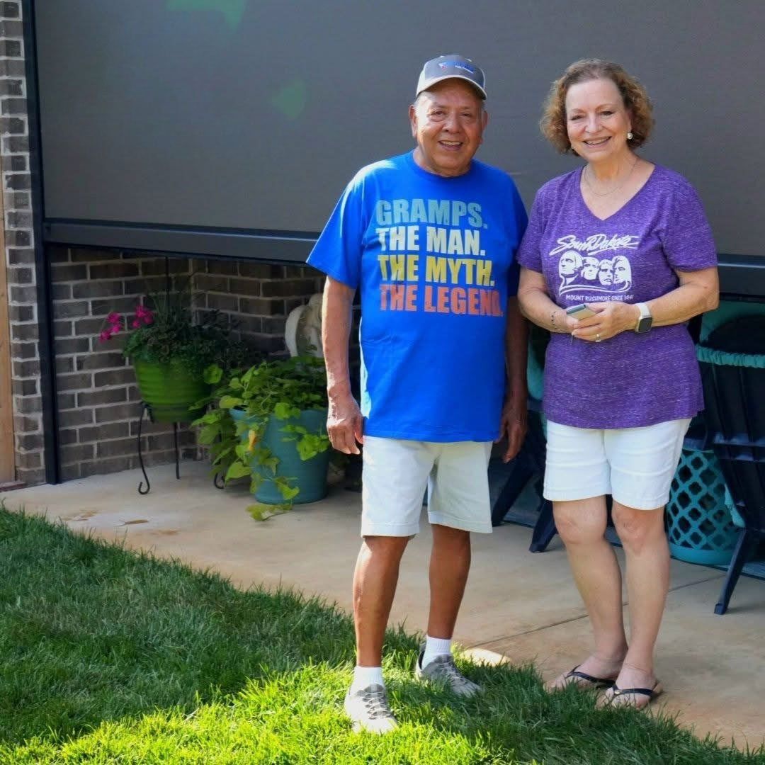Happy customers in front of their new screens