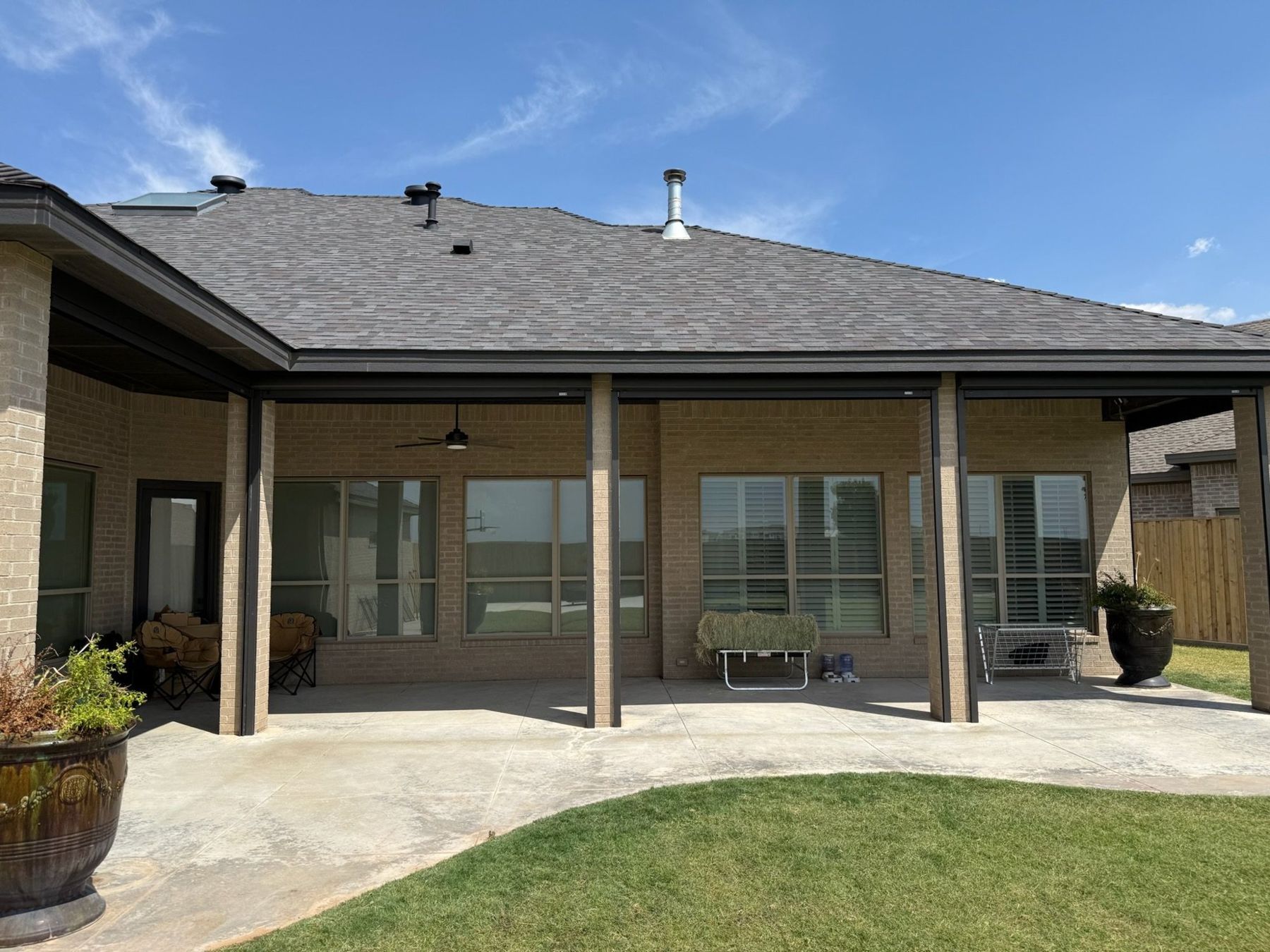 Covered patio with screens rolled up out of sight