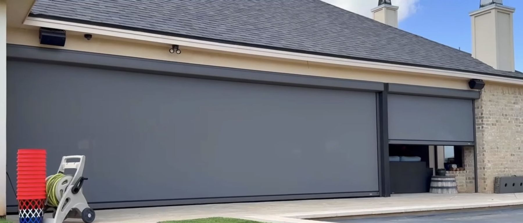 Screens lowered beside a pool